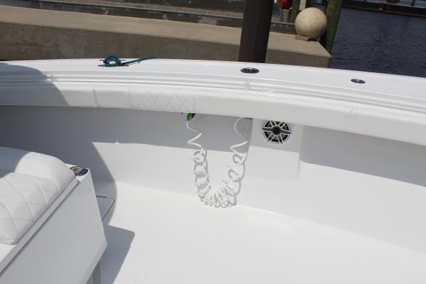 Slide: The Image of 2021 Onslow Bay 41 Tournament Edition boat interior with white seating and coiled hose. - 41