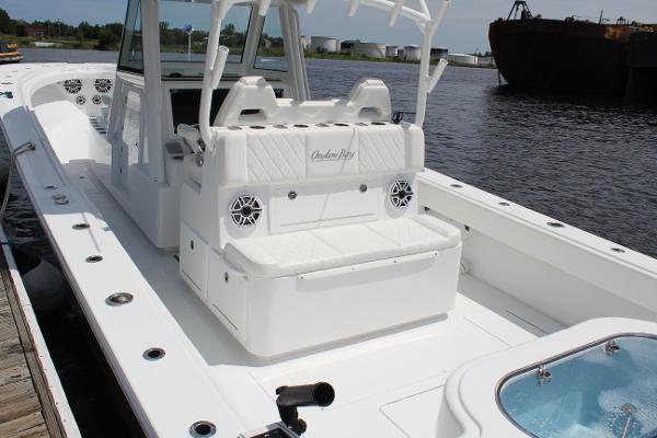 Slide: The Image of 2021 Onslow Bay 41 Tournament Edition boat interior with seating and speakers. - 45