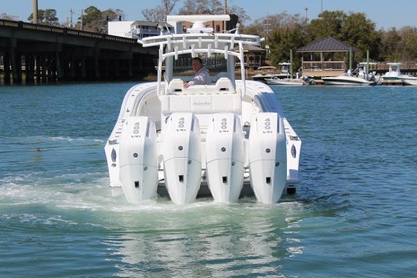 Slide: The Image of 2021 Onslow Bay 41 Tournament Edition boat with quad engines on the water. - 8