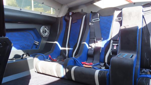 Slide: The Image of 2020 Outerlimits 46SC interior with blue and black racing seats and harnesses. - 21