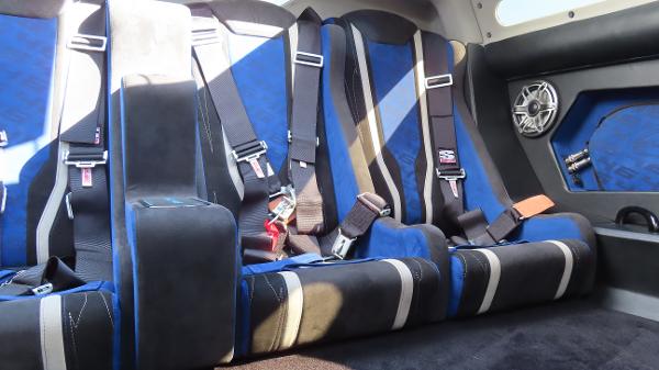 Slide: The Image of 2020 Outerlimits 46SC interior with blue and black racing seats and harnesses. - 22