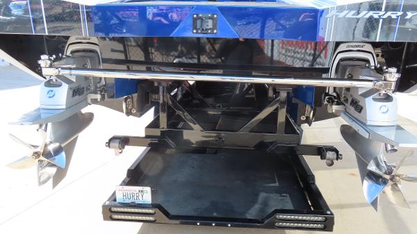 Slide: The Image of 2020 Outerlimits 46SC boat rear view with dual propellers and license plate. - 8
