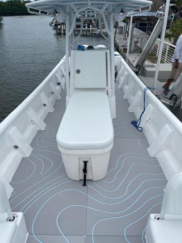 Slide: The Image of 2022 Panga Eduardoño Corvina 32 ft Panga boat interior with seating and storage. - 16
