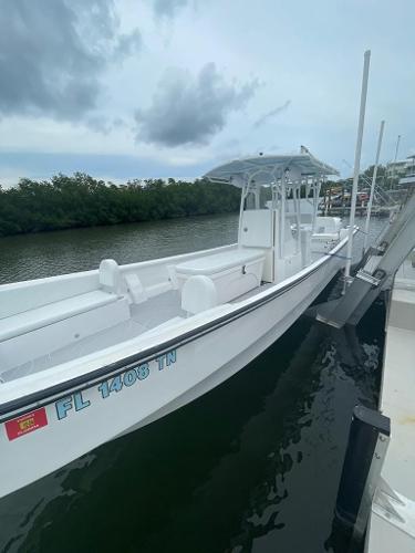 Slide: The Image of 2022 Panga Eduardoño Corvina 32 ft Panga boat docked by the river. - 19