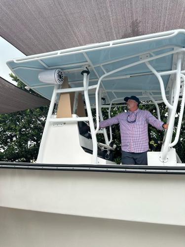 Slide: The Image of Man standing on 2022 Panga Eduardoño Corvina 32 ft Panga boat under canopy. - 6