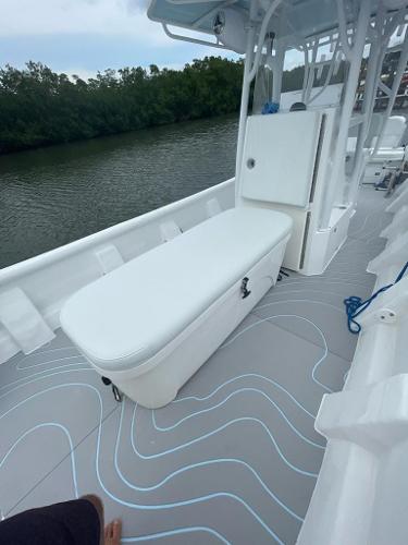 Slide: The Image of 2022 Panga Eduardoño Corvina 32 ft Panga boat interior with seating and storage. - 9