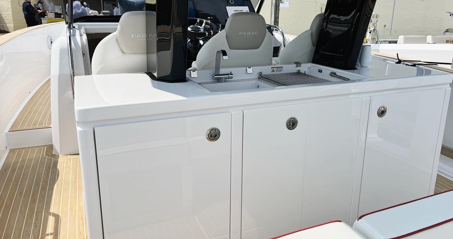 Slide: The Image of 2025 Pardo Yachts 38 Outboard interior with sleek white cabinetry and modern design. - 16