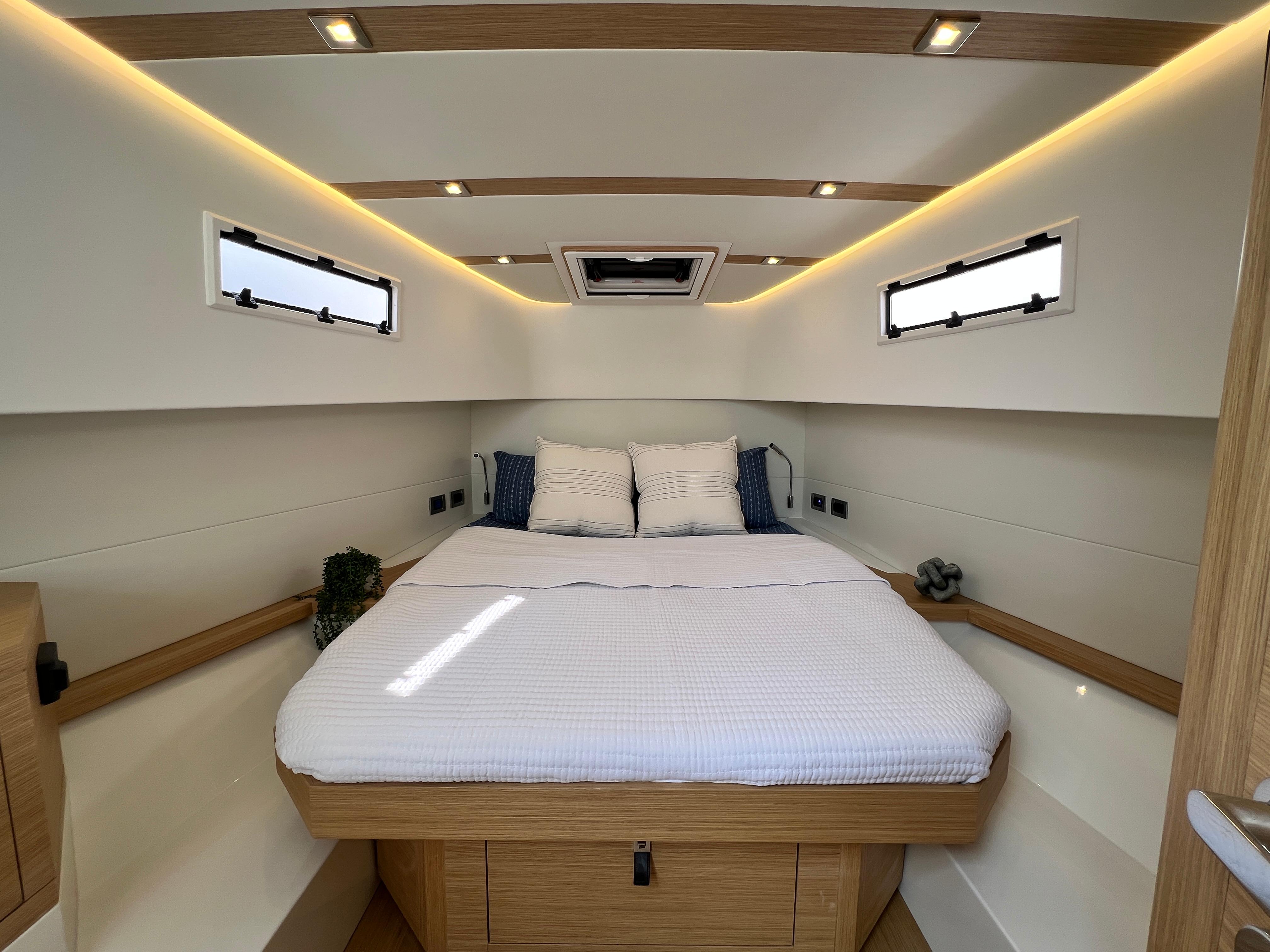 Slide: The Image of Luxurious cabin interior of 2025 Pardo Yachts 38 Outboard, featuring a cozy bed and modern design. - 19