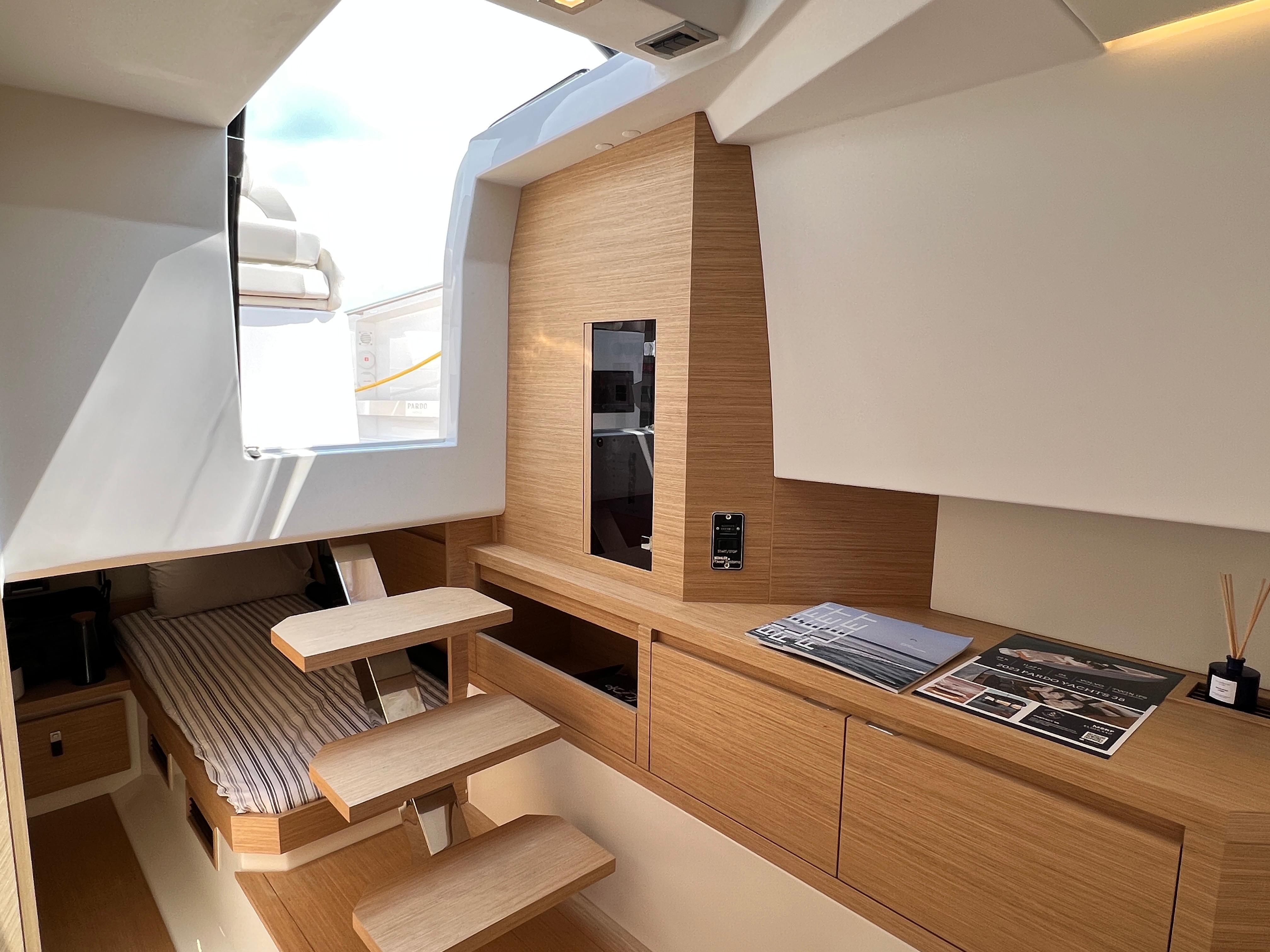 Slide: The Image of Interior of 2025 Pardo Yachts 38 Outboard, featuring modern wood finishes and sleek design. - 20