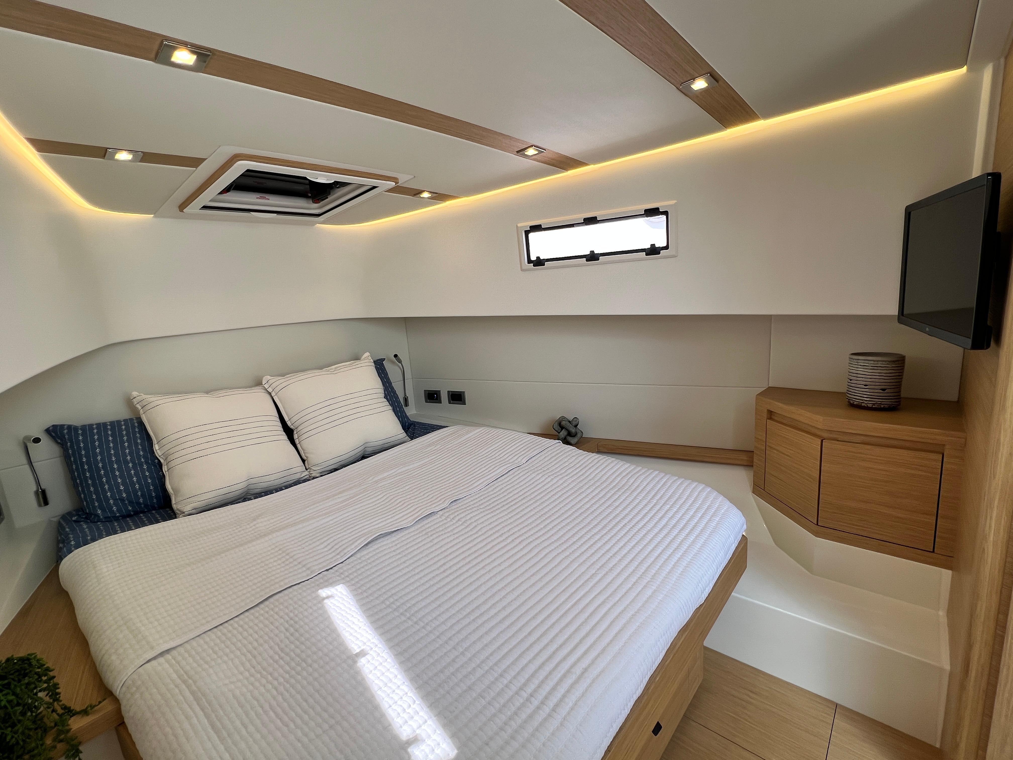 Slide: The Image of Luxurious cabin interior of 2025 Pardo Yachts 38 Outboard, featuring modern design and cozy bedding. - 21