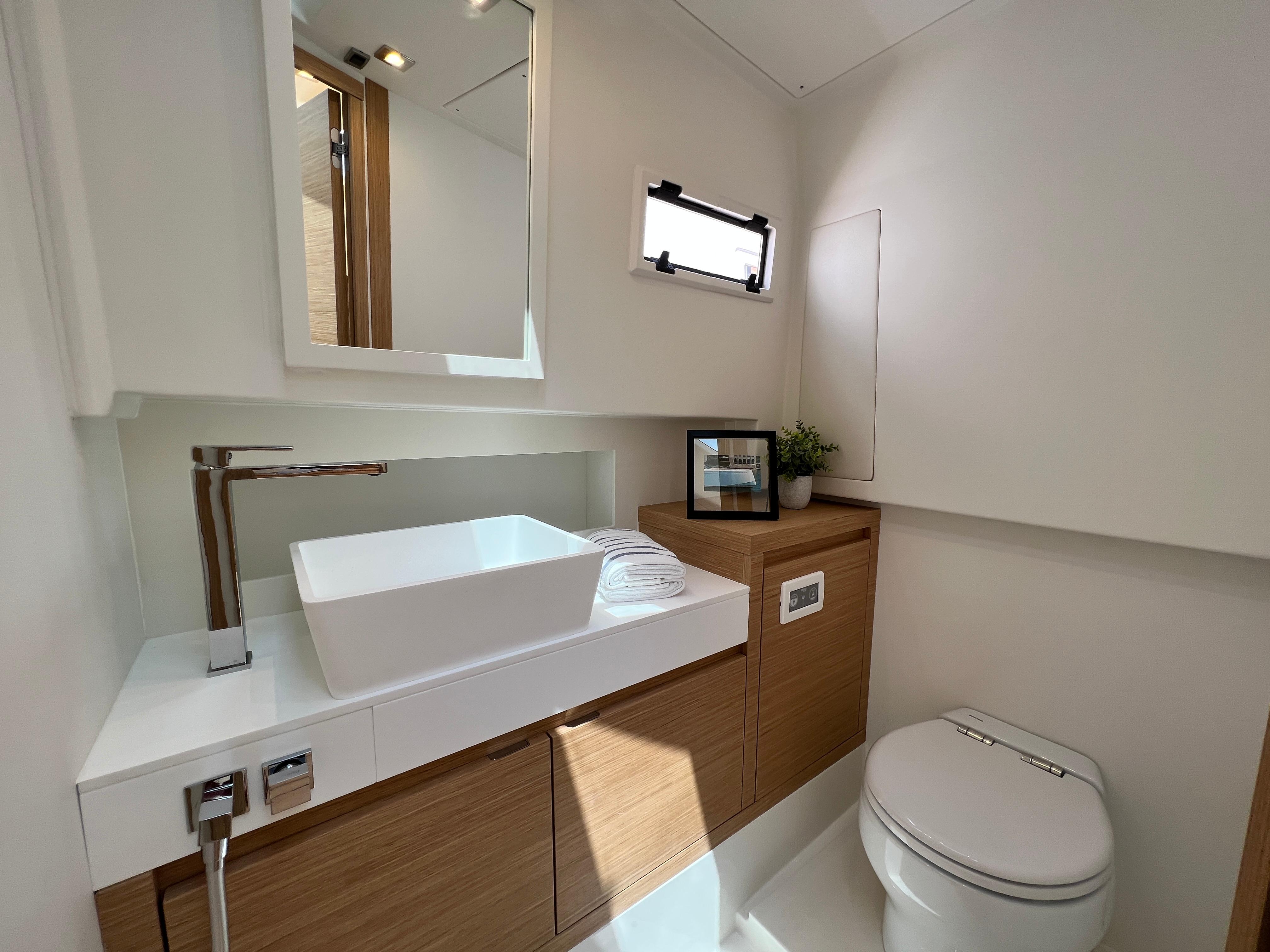 Slide: The Image of Luxurious bathroom interior of 2025 Pardo Yachts 38 Outboard, featuring modern sink and toilet. - 24