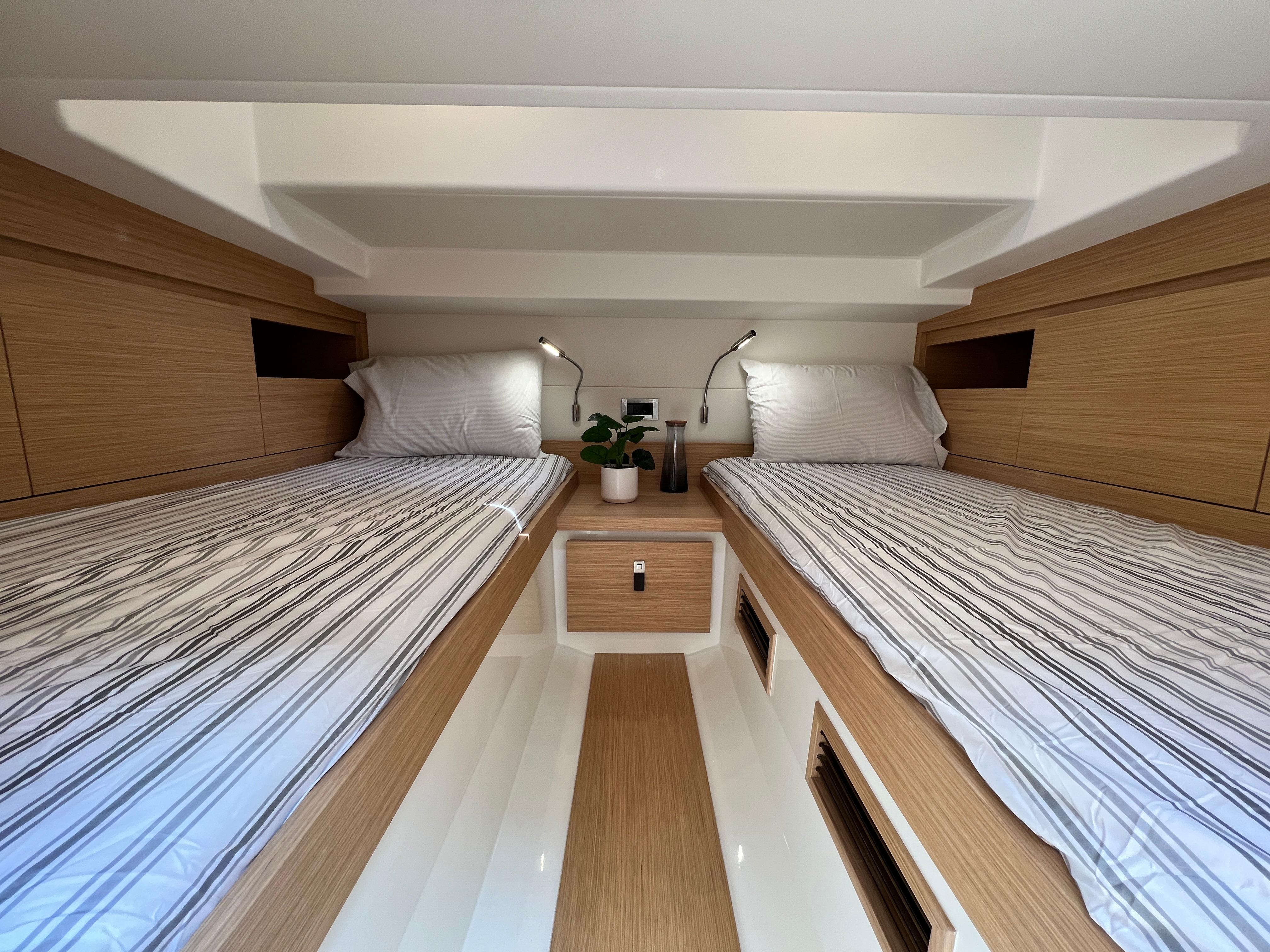 Slide: The Image of Interior cabin of 2025 Pardo Yachts 38 Outboard with twin beds and modern design. - 26