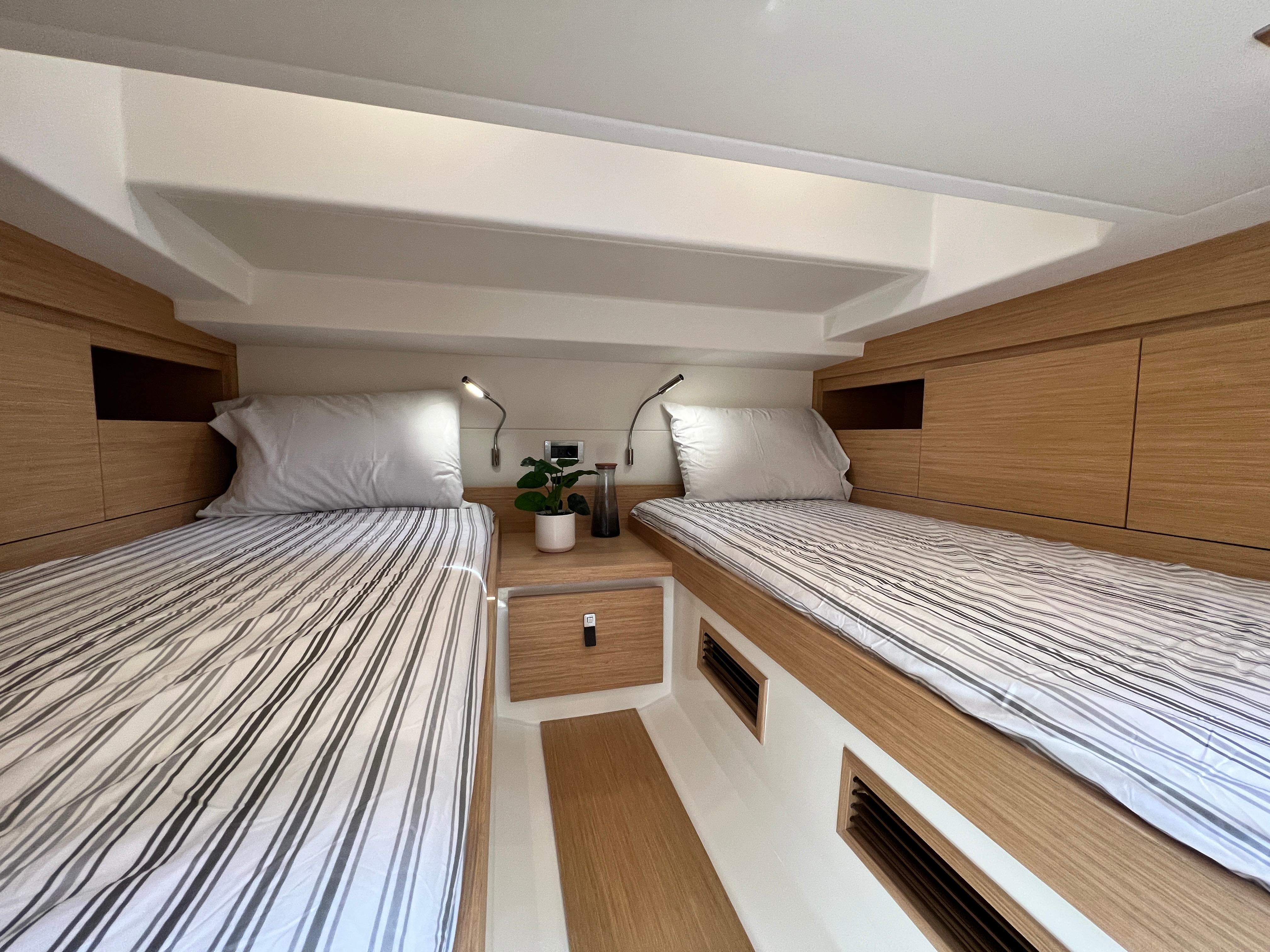Slide: The Image of Interior cabin of 2025 Pardo Yachts 38 Outboard with twin beds and modern design. - 27