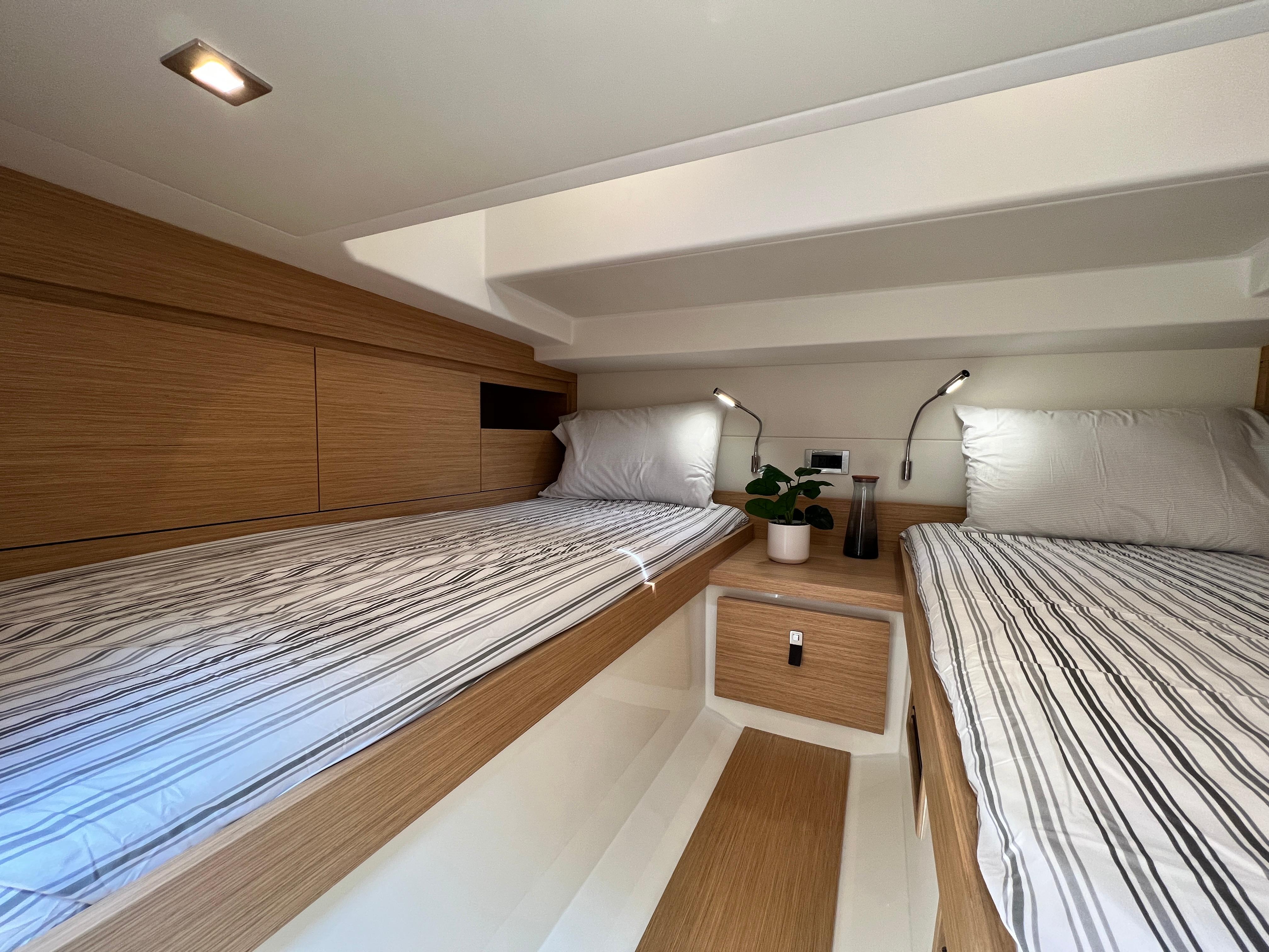 Slide: The Image of Interior cabin of 2025 Pardo Yachts 38 Outboard with twin beds and modern decor. - 28