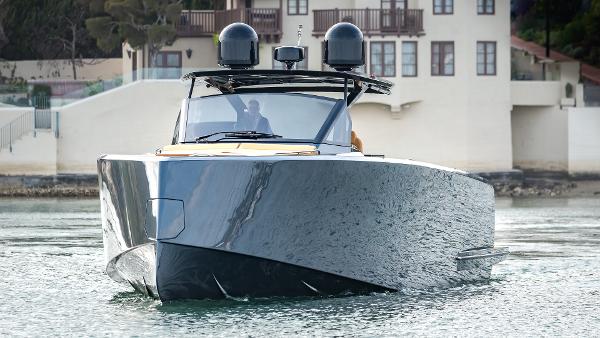 Slide: The Image of 2022 Pardo Yachts 50 cruising on water near coastal buildings. - 12