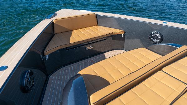 Slide: The Image of 2022 Pardo Yachts 50 interior with tan seating, on calm blue water. - 24