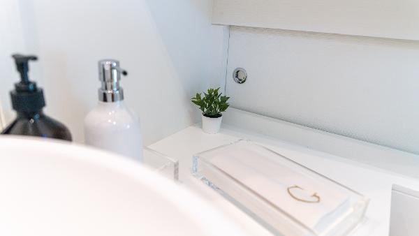 Slide: The Image of Modern bathroom interior on 2022 Pardo Yachts 50, featuring soap dispensers and a small plant. - 47