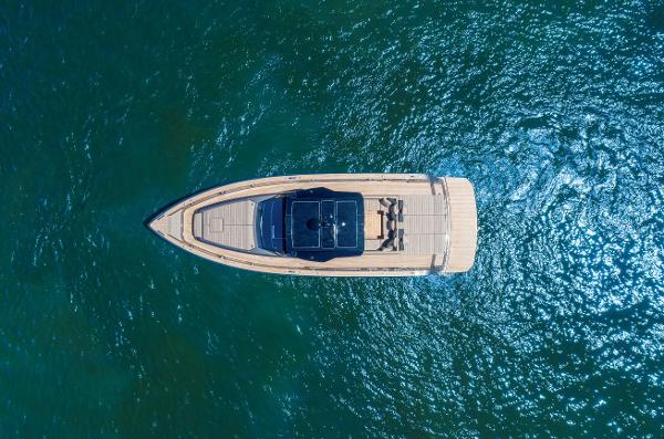 Slide: The Image of Aerial view of 2025 Pardo Yachts 50 model cruising on clear blue water. - 1