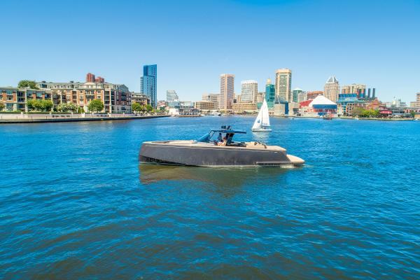Slide: The Image of Pardo Yachts 50 (2025) cruising in a city harbor with skyline in the background. - 6
