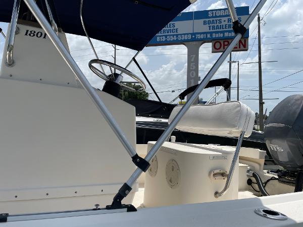 Slide: The Image of 2004 Parker 1801 Center Console boat with steering wheel and seating. - 11