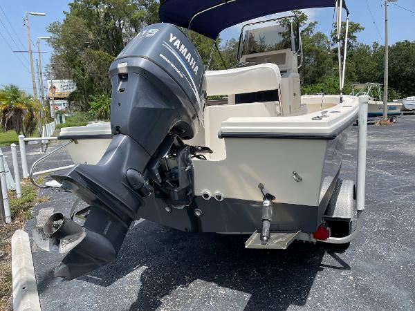 Slide: The Image of 2004 Parker 1801 Center Console boat with Yamaha outboard motor, parked on a trailer. - 3