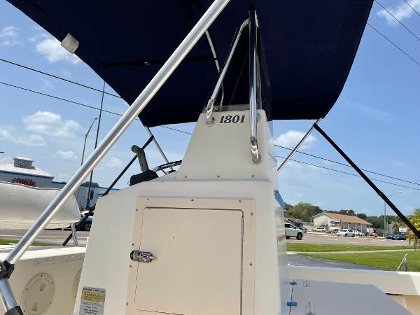 Slide: The Image of 2004 Parker 1801 Center Console boat with blue canopy. - 7