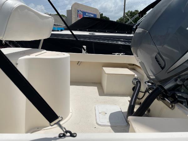 Slide: The Image of 2004 Parker 1801 Center Console boat interior with motor and seating. - 9