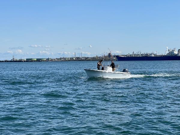 Slide: The Image of 2023 Parker 1801 Center Console boat cruising on open water. - 9