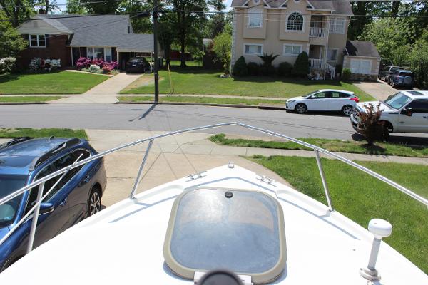 Slide: The Image of View from the bow of a 1996 Parker 2110 Walkaround boat in a suburban neighborhood. - 17