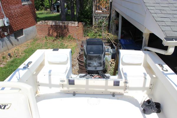 Slide: The Image of 1996 Parker 2110 Walkaround boat with outboard motor in backyard. - 18