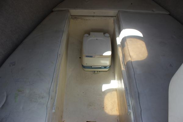 Slide: The Image of Interior cabin of a 1996 Parker 2110 Walkaround boat with portable toilet. - 22