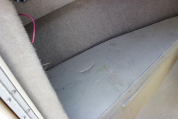 Slide: The Image of Interior cabin of a 1996 Parker 2110 Walkaround boat with cushioned seating. - 23