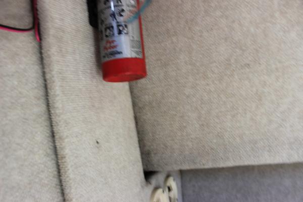 Slide: The Image of Fire extinguisher mounted on the interior of a 1996 Parker 2110 Walkaround boat. - 27