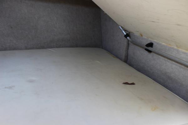 Slide: The Image of Interior cabin of 1996 Parker 2110 Walkaround boat with grey upholstery. - 29