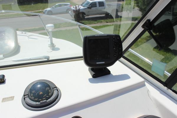 Slide: The Image of 1996 Parker 2110 Walkaround boat dashboard with compass and navigation system. - 30
