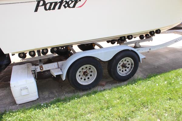 Slide: The Image of 1996 Parker 2110 Walkaround boat on a dual-axle trailer. - 32