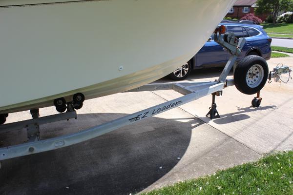 Slide: The Image of 1996 Parker 2110 Walkaround boat on EZ Loader trailer in driveway. - 33