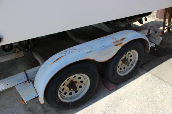 Slide: The Image of Rusty trailer wheels of a 1996 Parker 2110 Walkaround boat. - 36