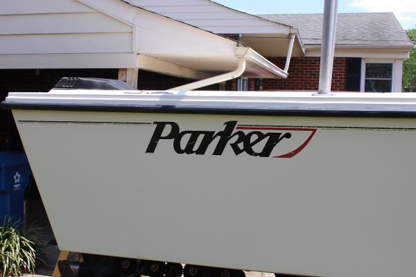Slide: The Image of 1996 Parker 2110 Walkaround boat side view with logo. - 4