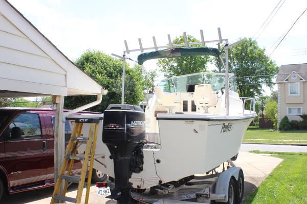 Slide: The Image of 1996 Parker 2110 Walkaround boat on trailer with Mercury outboard motor. - 7