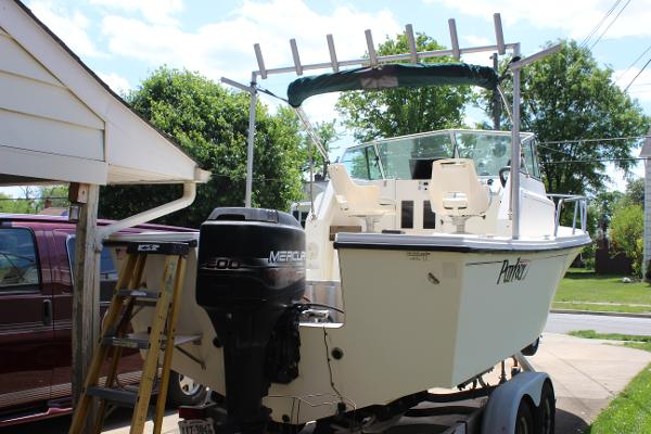 Slide: The Image of 1996 Parker 2110 Walkaround boat with Mercury outboard motor on trailer. - 8