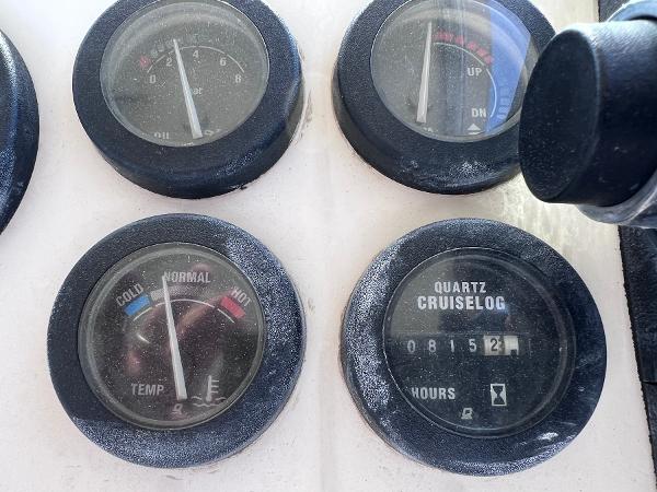 Slide: The Image of Close-up of 2002 Parker 2510 Walkaround boat gauges, including temperature and quartz cruiselog. - 10