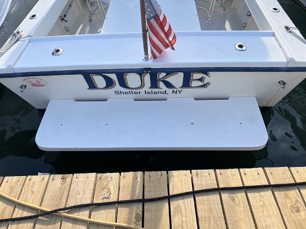 Slide: The Image of Back view of 2002 Parker 2510 Walkaround boat named Duke docked at Shelter Island, NY. - 19