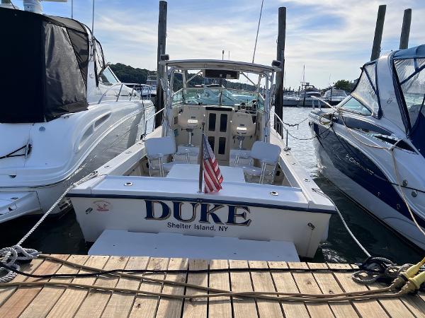Slide: The Image of 2002 Parker 2510 Walkaround boat docked at marina, named DUKE, Shelter Island, NY. - 20