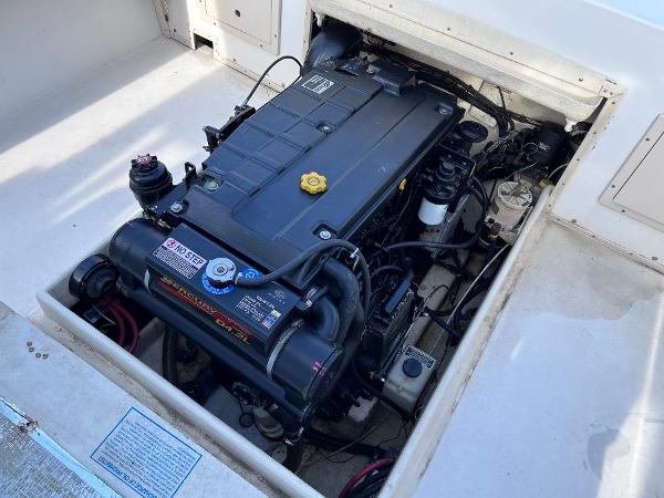 Slide: The Image of 2002 Parker 2510 Walkaround boat engine compartment with inboard motor. - 26