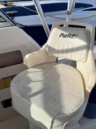 Slide: The Image of Parker 2510 Walkaround 2002 boat seat with logo in cockpit area. - 6