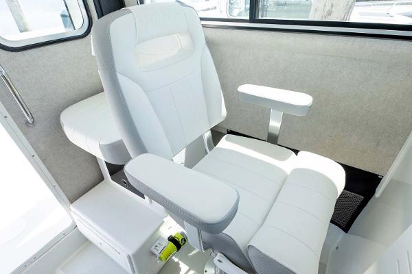 Slide: The Image of Manufacturer Provided Image: Captain's chair in the 2025 Parker 2820 XLD Sport Cabin boat. - 12
