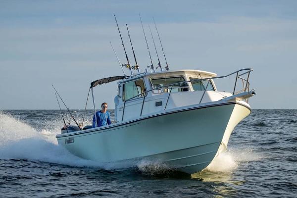 Slide: The Image of Manufacturer Provided Image: 2025 Parker 2820 XLD Sport Cabin boat cruising on open water. - 3