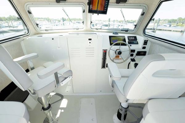 Slide: The Image of Manufacturer Provided Image: Interior of 2025 Parker 2820 XLD Sport Cabin boat with modern helm and seating. - 8