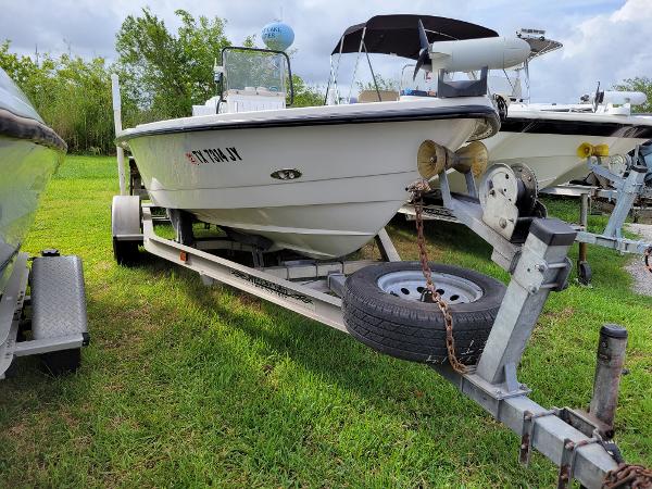 Slide: The Image of 2001 Pathfinder 1806V boat on trailer, parked on grass. - 1